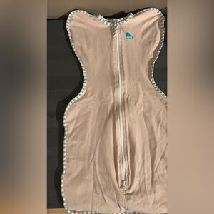 Love to dream blush pink zip-front swaddle bodysuit with striped trim